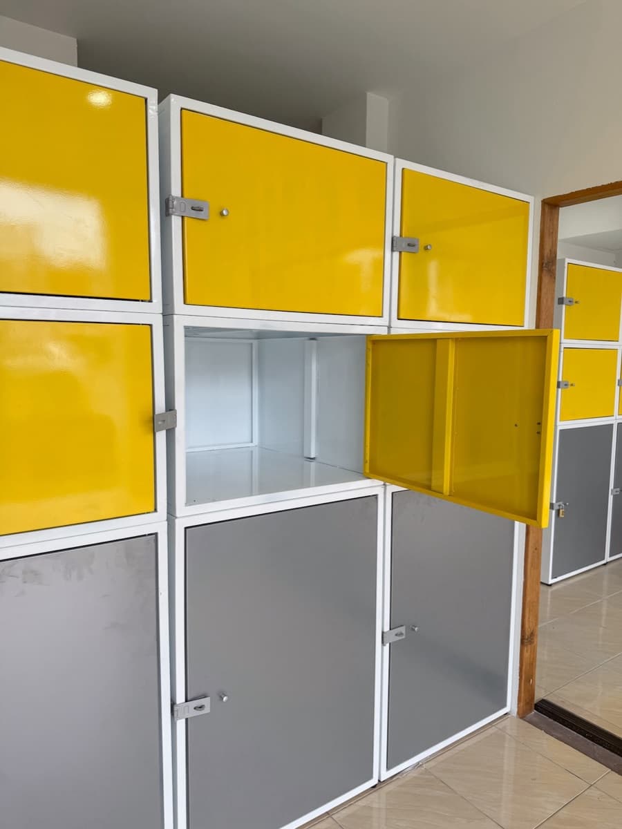 A yellow locker standing open with the door swung out
